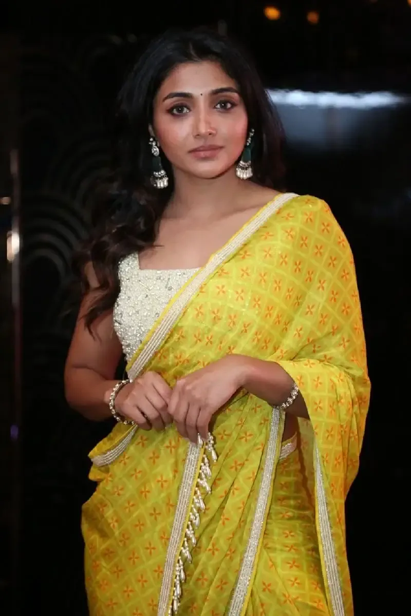 Indian Actress Mirnaa Menon in Yellow Saree at Ugram Movie Teaser Launch